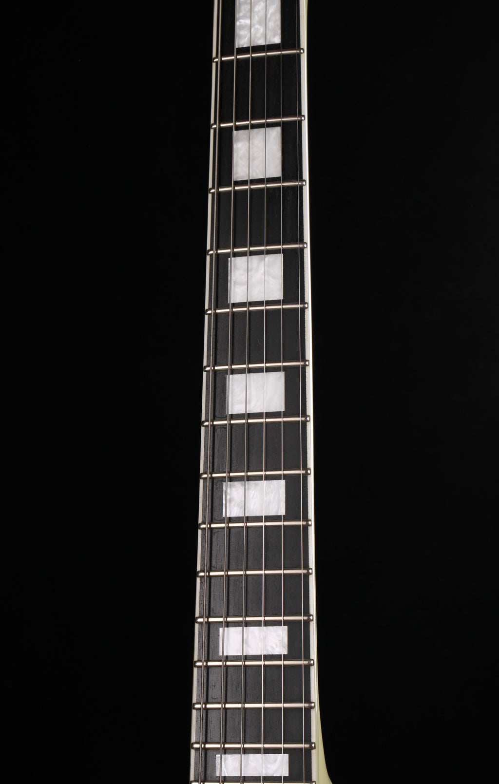 Edwards by ESP E-LP-130CD WH Les Paul Custom Antique White 2009 Seymour Duncan Pickups Close-up of a guitar neck with frets on a black background
