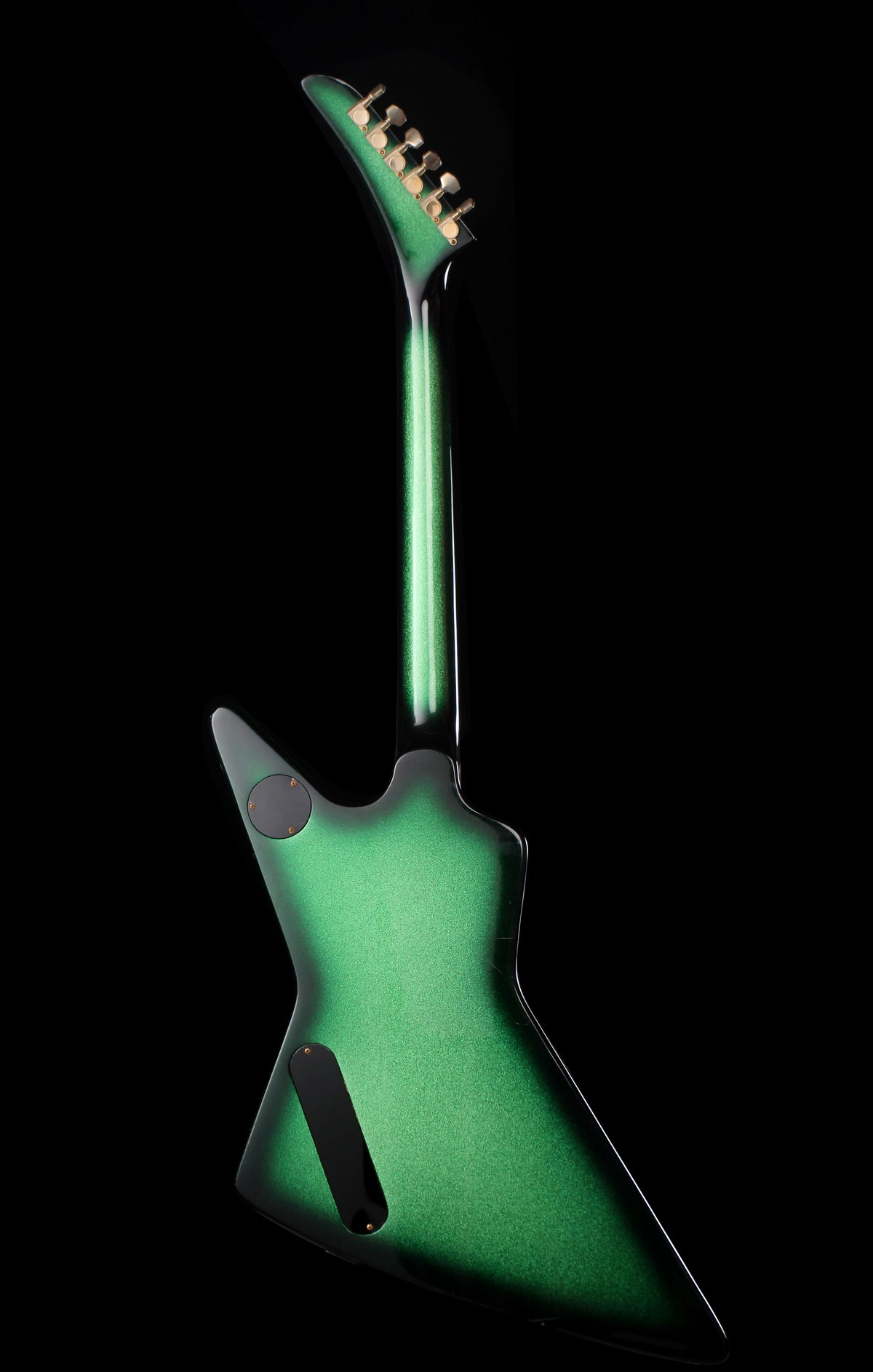 Fernandes EX Explorer Special Order SGS Sparkle Green Sunburst MIJ 1984: A green electric guitar shown from the back against a solid black background.